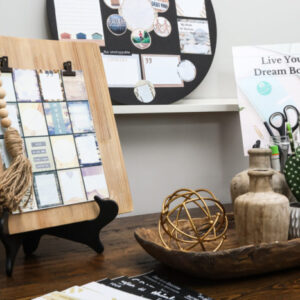 closeup of natural themed graphics on wood shelf on rustic brown desk