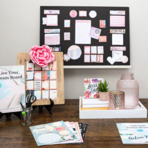 pink rectangle board on white shelf with staging material