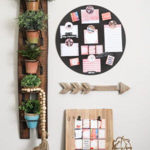 pink on black circle board displayed on table