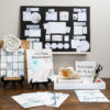 complete kit and supplies for creating a vision board displayed on table. white large flower decor