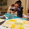 goal Getter - college girl focused on creation of her first vision board with friends