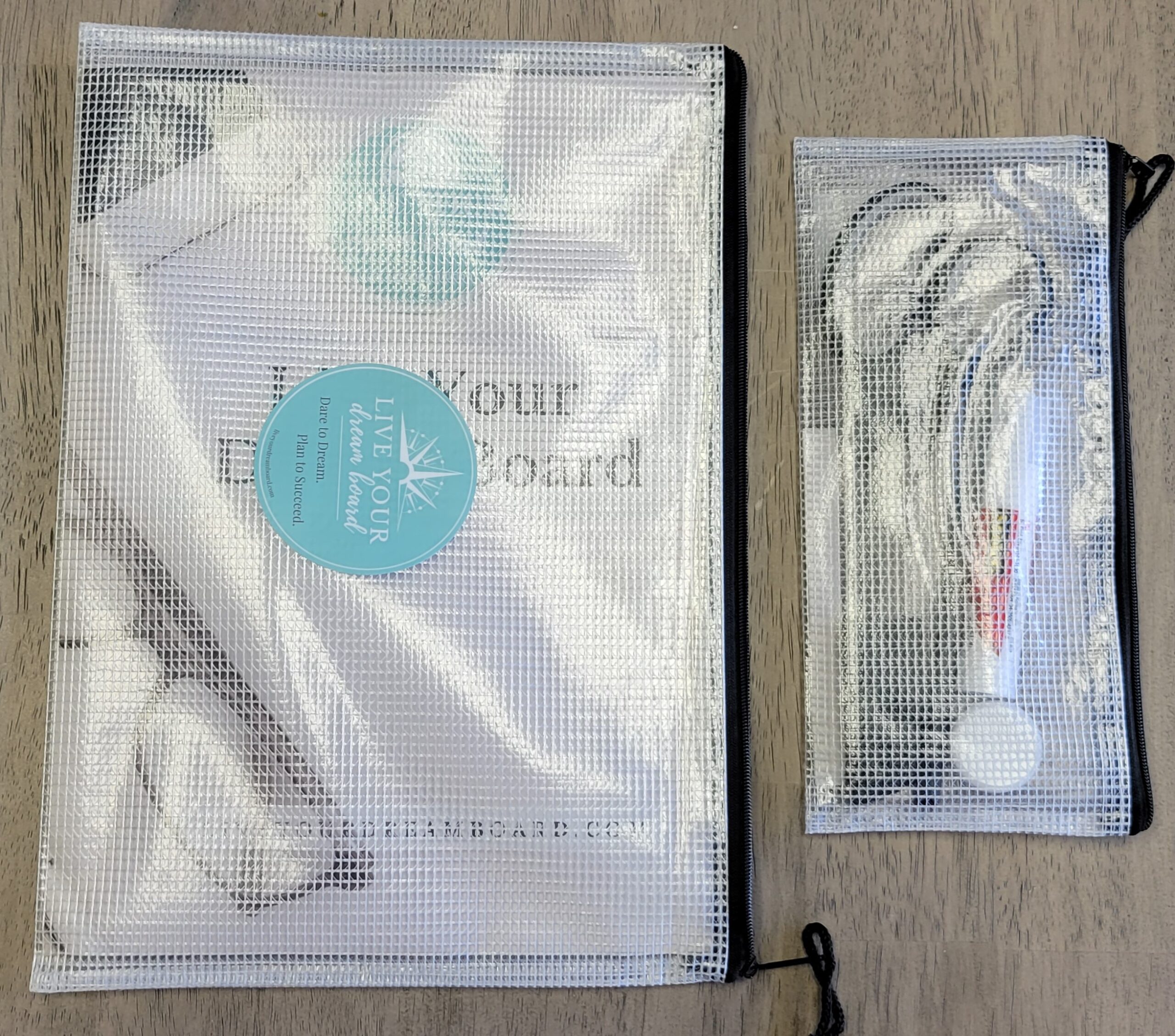 zipper pouches holding a dream board kit