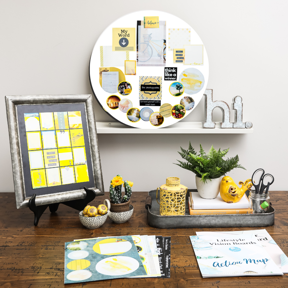 product photo of yellow color vision board kit showing completed circle board, graphics, images and photos and workbook