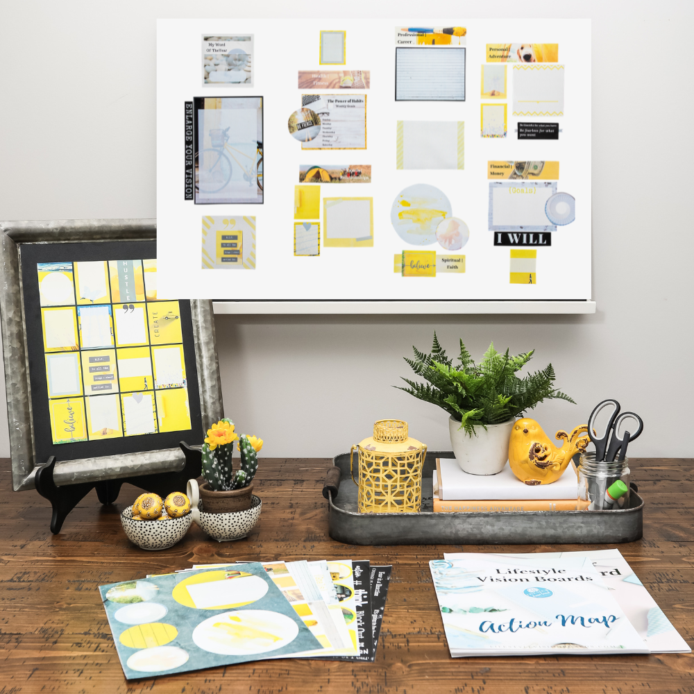 product photo for yellow themed dream board kit including foam board, layout samples and ideas, creating tools and graphics, images, words and quotes all on a wood table