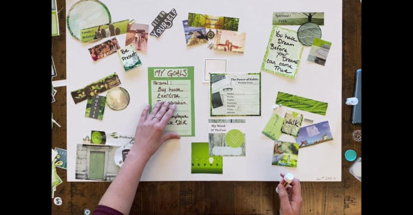White Vision board (rectangle) with Green Graphics being put together